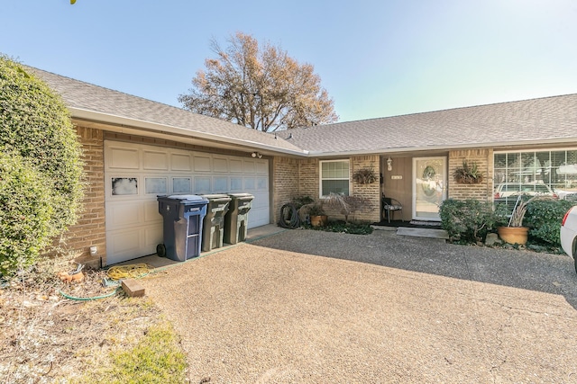 ranch-style house featuring a garage