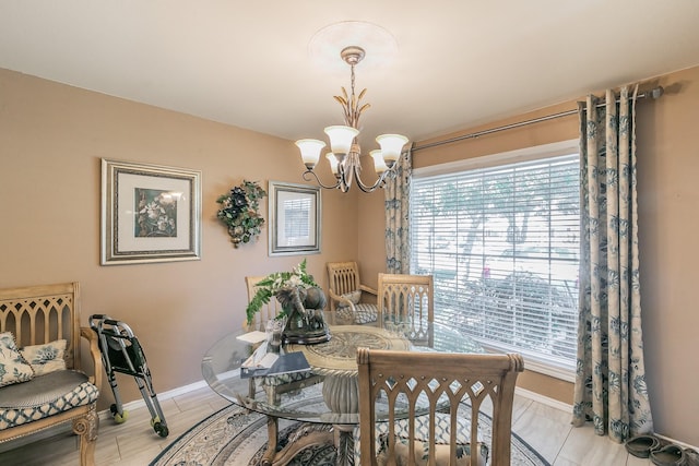 dining room with a notable chandelier