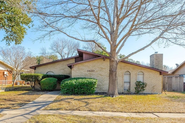 view of property exterior featuring a lawn