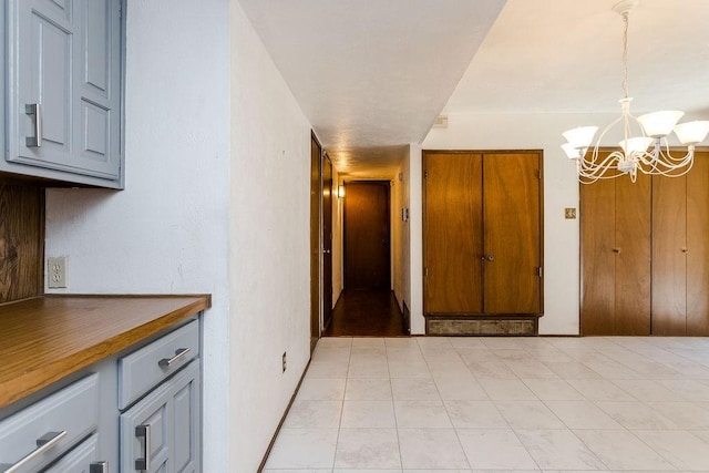 corridor with a chandelier