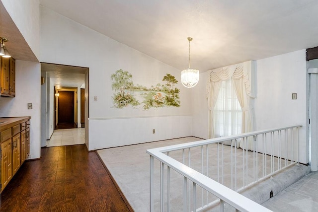 dining room with dark hardwood / wood-style floors and a notable chandelier