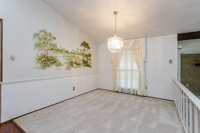 unfurnished dining area with an inviting chandelier and light colored carpet