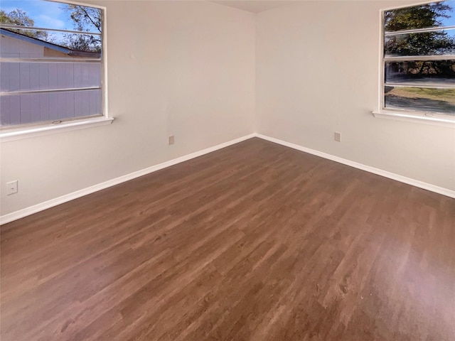 spare room featuring dark hardwood / wood-style flooring