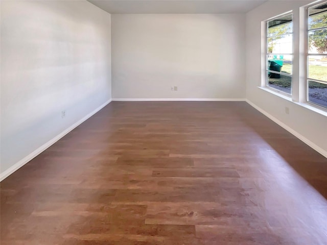 spare room featuring dark hardwood / wood-style floors