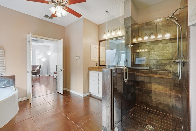 bathroom featuring ceiling fan, vanity, shower with separate bathtub, and tile patterned flooring