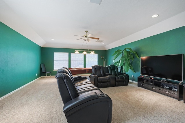 carpeted living room with ceiling fan and lofted ceiling