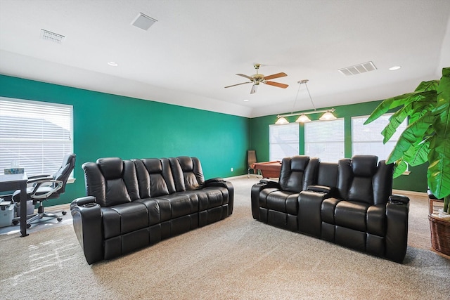 living room with ceiling fan, a healthy amount of sunlight, and light carpet