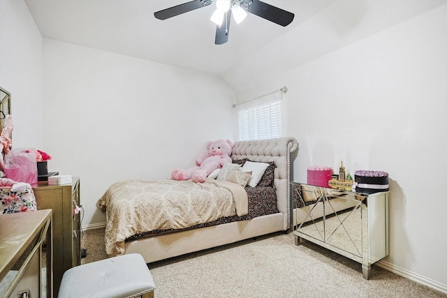 bedroom with vaulted ceiling, ceiling fan, and carpet flooring