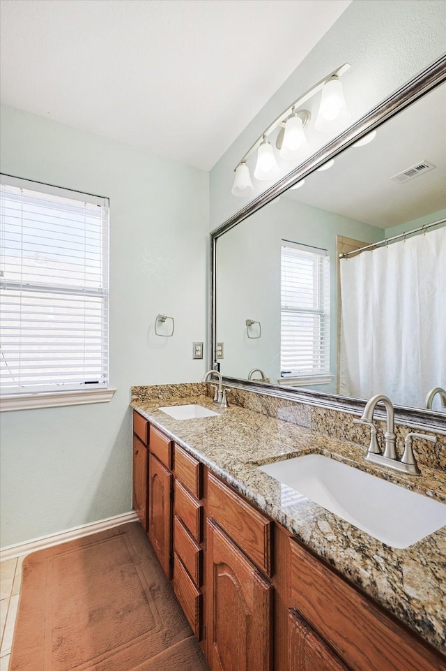 bathroom with vanity and tile patterned floors