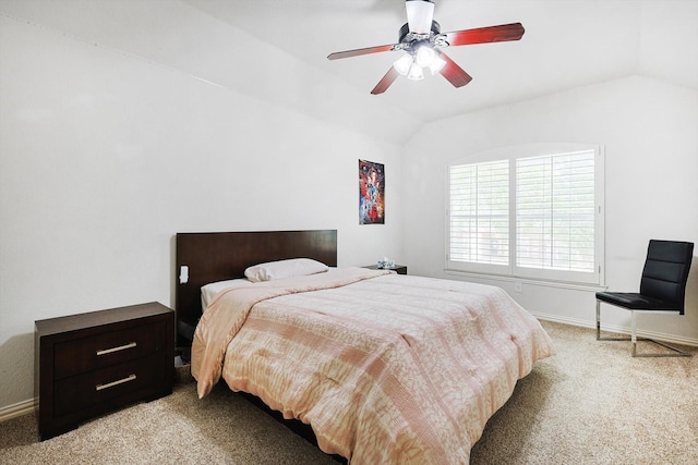 carpeted bedroom with ceiling fan and vaulted ceiling