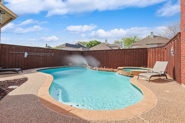 view of pool featuring an in ground hot tub and a patio