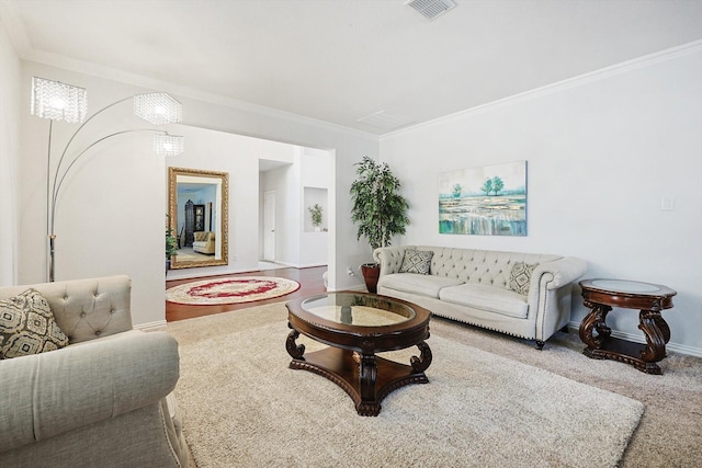 living room featuring ornamental molding and carpet