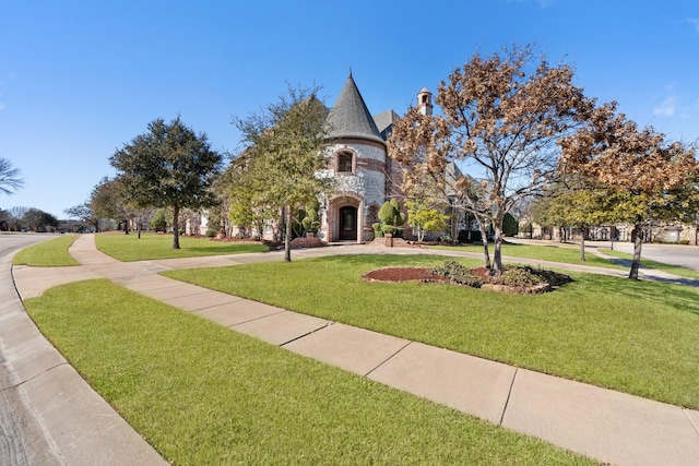 view of front of home featuring a front lawn