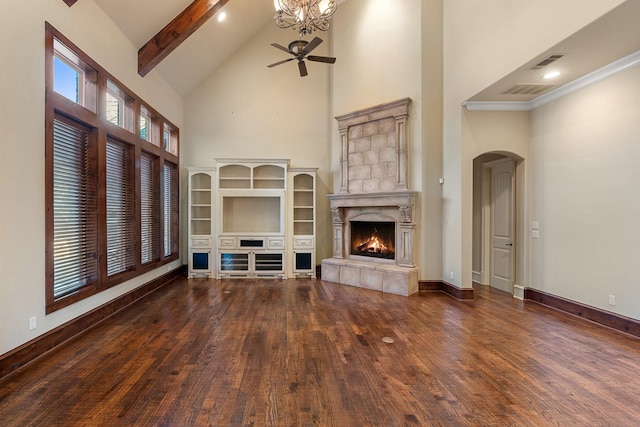 unfurnished living room featuring beam ceiling, a high end fireplace, high vaulted ceiling, and dark hardwood / wood-style floors