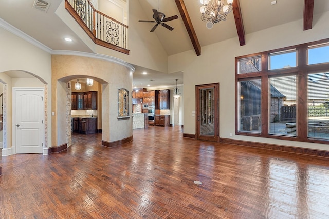 unfurnished living room with beam ceiling, high vaulted ceiling, dark hardwood / wood-style floors, and ceiling fan