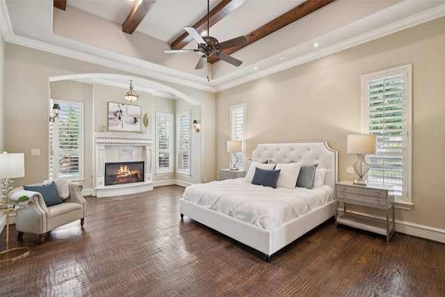 6900 Sir Spencer Ct, Colleyville, TX 76034 - bedroom with multiple windows, beamed ceiling, arched walkways, a high end fireplace, and wood finished floors