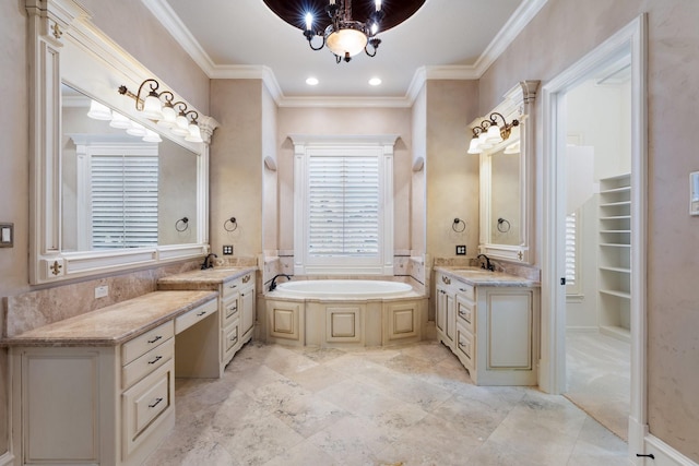 bathroom featuring a washtub, vanity, and ornamental molding