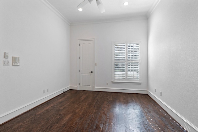 spare room with ornamental molding, ceiling fan, and dark hardwood / wood-style flooring