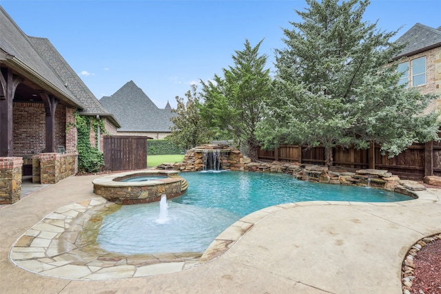 6900 Sir Spencer Ct, Colleyville, TX 76034 - view of swimming pool with a fenced backyard, a pool with connected hot tub, and a patio
