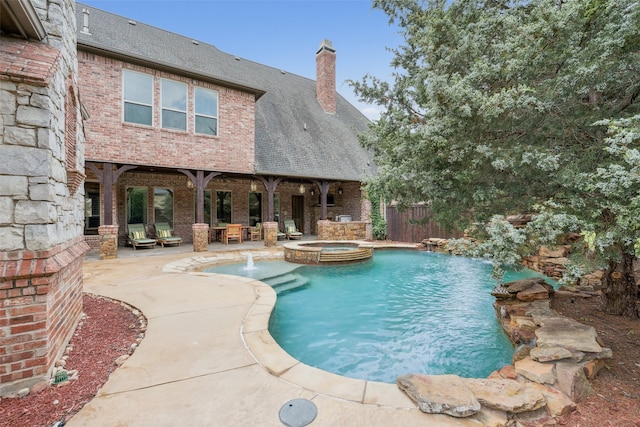 6900 Sir Spencer Ct, Colleyville, TX 76034 - view of pool with a patio area and a pool with connected hot tub