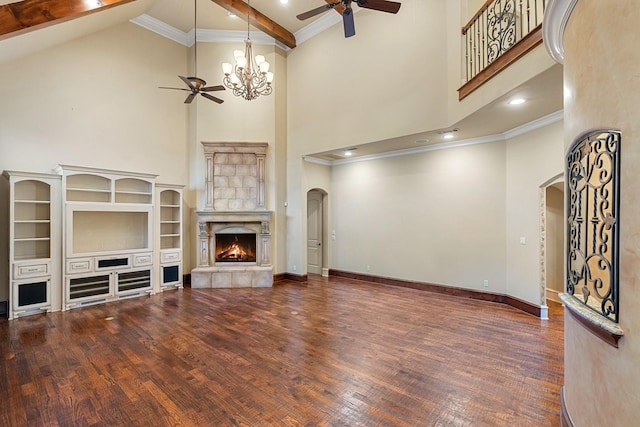 living room featuring dark hardwood / wood-style flooring, ceiling fan with notable chandelier, and crown molding