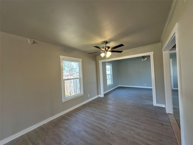 spare room featuring crown molding, ceiling fan, hardwood / wood-style floors, and a textured ceiling