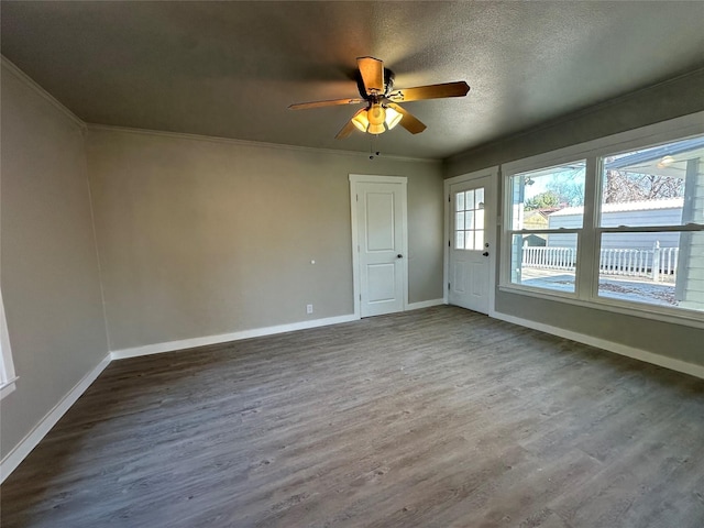 spare room with crown molding, ceiling fan, hardwood / wood-style floors, and a textured ceiling