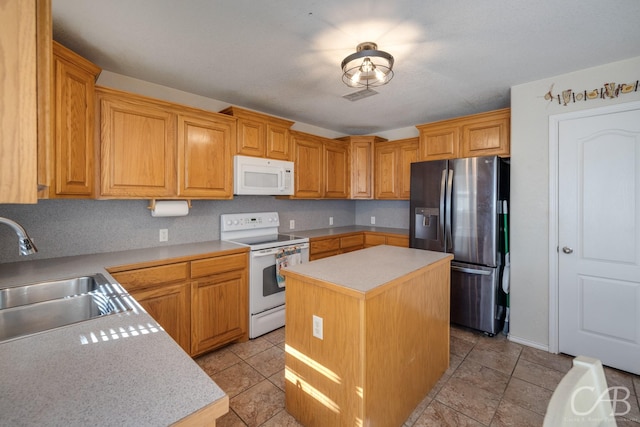 kitchen with light tile patterned flooring, white appliances, a center island, and sink