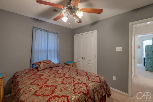 carpeted bedroom with ceiling fan