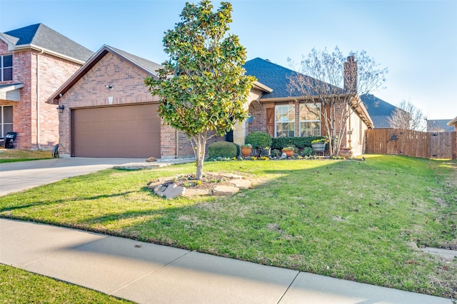 view of front facade with a garage and a front lawn