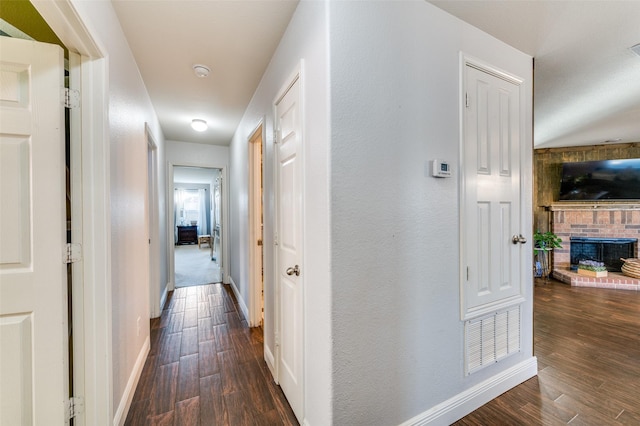 hallway with dark wood-type flooring