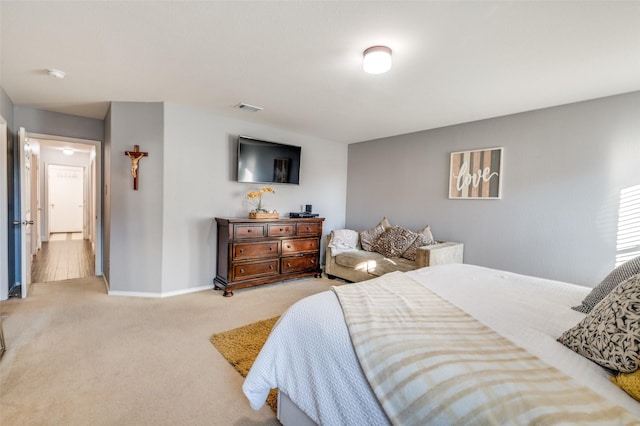 bedroom with light carpet