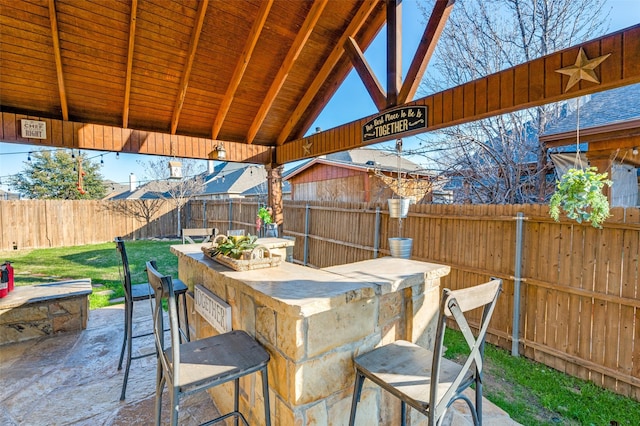 view of patio / terrace with a bar and a gazebo