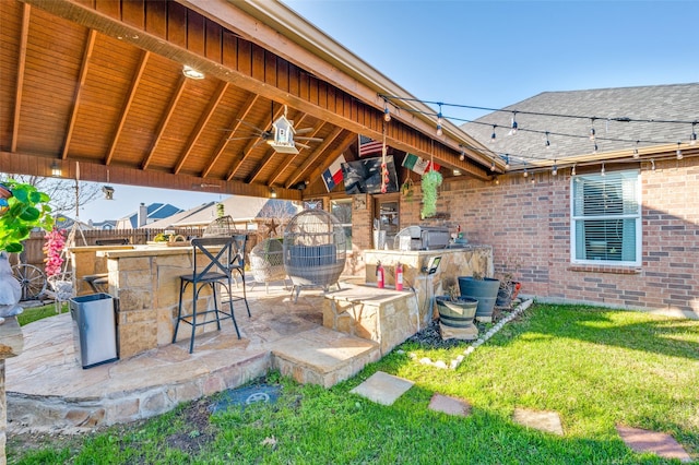 view of patio with an outdoor bar