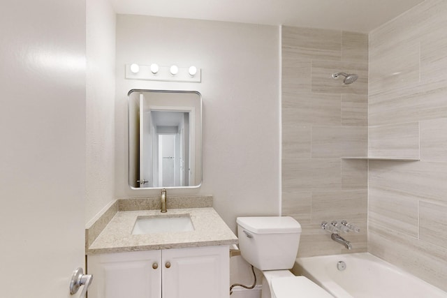 full bathroom featuring vanity, tiled shower / bath combo, and toilet