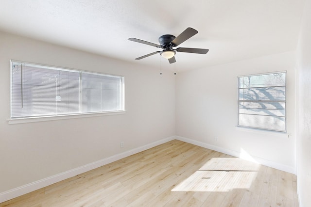 spare room featuring light hardwood / wood-style flooring and ceiling fan