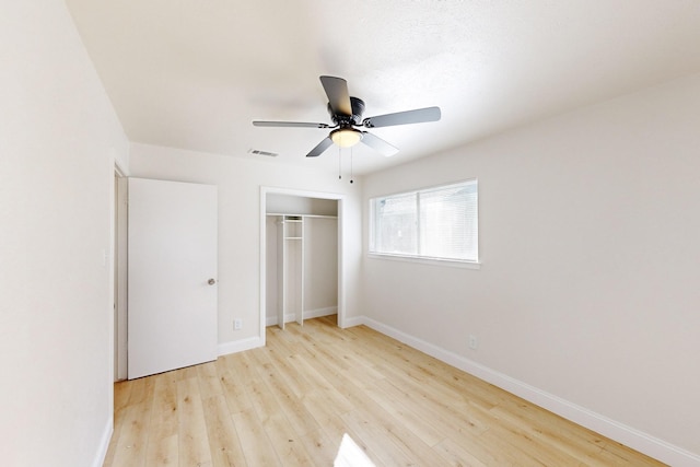 unfurnished bedroom with a closet, ceiling fan, and light hardwood / wood-style flooring