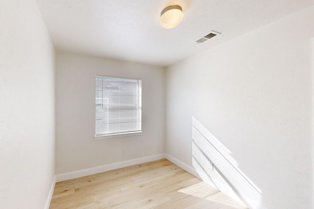 unfurnished room featuring light hardwood / wood-style floors