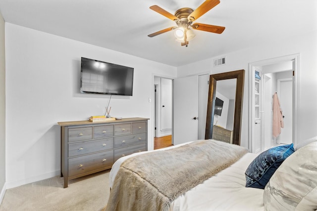 bedroom with light colored carpet and ceiling fan