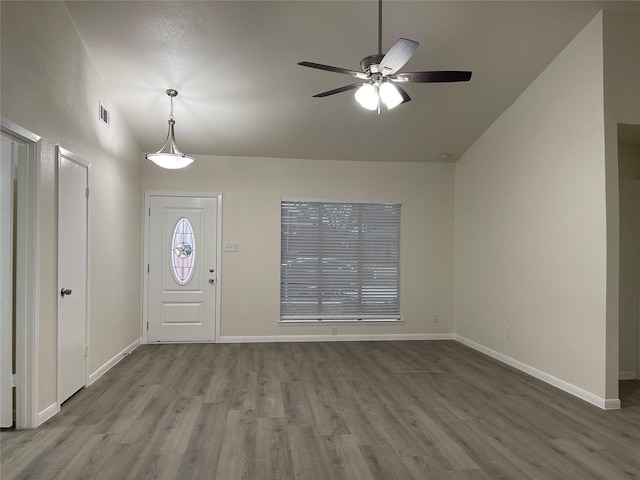 entrance foyer with light hardwood / wood-style flooring, ceiling fan, and vaulted ceiling