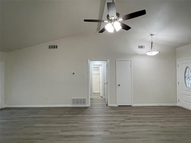 unfurnished living room featuring vaulted ceiling, ceiling fan, and hardwood / wood-style floors