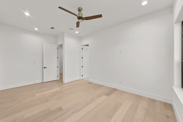 unfurnished room with ceiling fan and light hardwood / wood-style floors