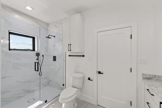 bathroom featuring vanity, toilet, and an enclosed shower