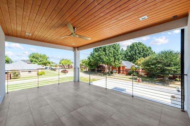 view of patio featuring a balcony and ceiling fan