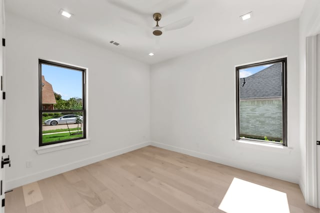 spare room with ceiling fan and light hardwood / wood-style floors