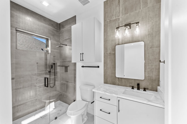 bathroom with vanity, an enclosed shower, and toilet