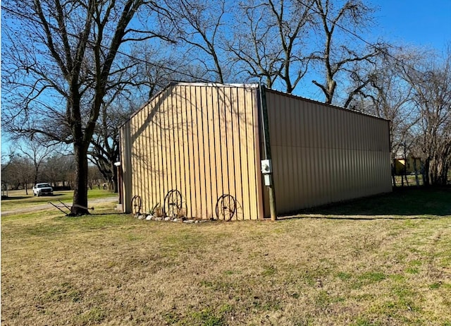 view of outdoor structure with a lawn