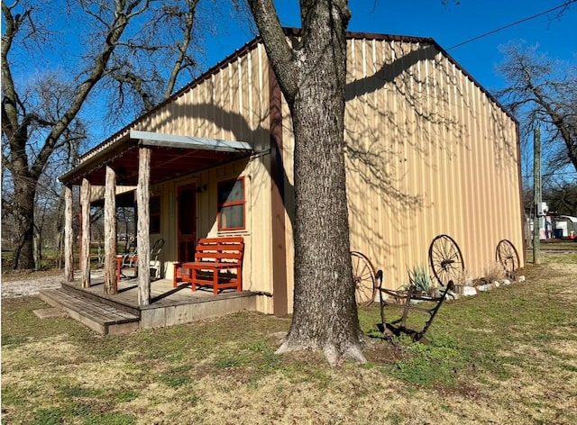 view of outbuilding featuring a yard