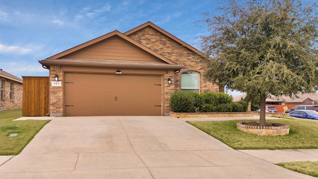 view of front of property with a garage and a front yard