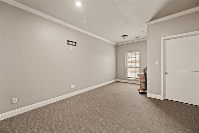 empty room with crown molding and dark carpet